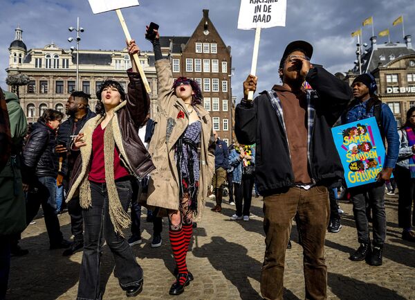 Demonstrators take part in an annual rally in Dam Square, in the Netherlands&#x27; capital Amsterdam on 18 March 2023. The demonstration is organized each year by Committee 21 March, to protest against racism and discrimination. - Sputnik International