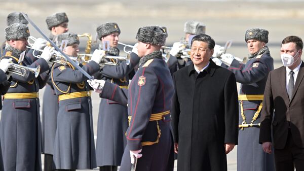 Chinese President Xi Jinping attends a welcoming ceremony upon arrival at Vnukovo International Airport in Moscow, Russia. - Sputnik International