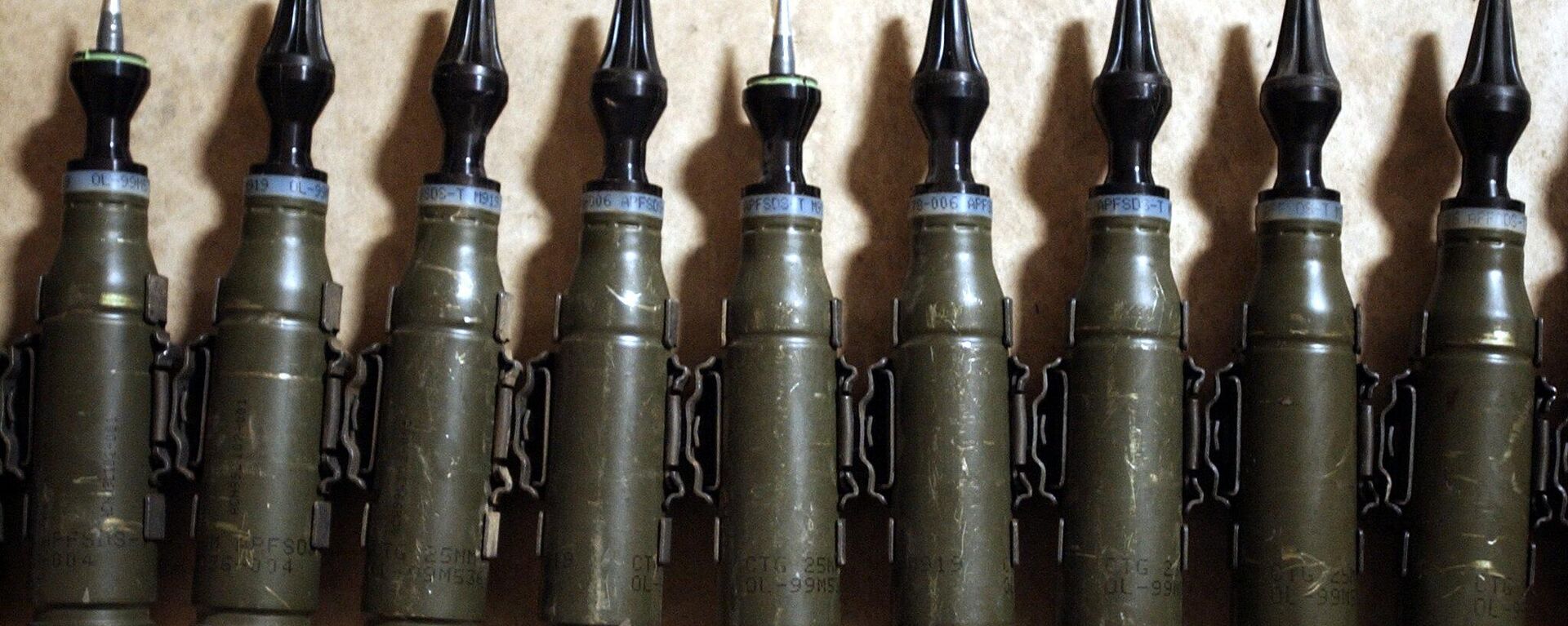 A row of US Army 25mm rounds of depleted uranium ammunition, 11 February 2004, at the base of Charlie Company, 1-22 Battalion, 4th Infantry Division, in Tikrit, 180 km (110 miles) north of Baghdad - Sputnik International, 1920, 28.03.2023