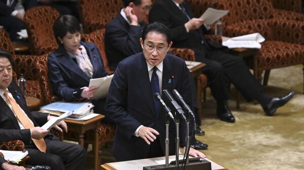 Japan's Prime Minister Fumio Kishida (C) answers questions during a budget committee session of the upper house at parliament in Tokyo on March 27, 2023. - Sputnik International
