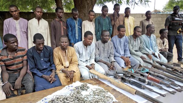 In this Wednesday July.18, 2018 file photo, A group of men identified by Nigerian police as Boko Haram extremist fighters and leaders are shown to the media, in Maiduguri, Nigeria.  - Sputnik International