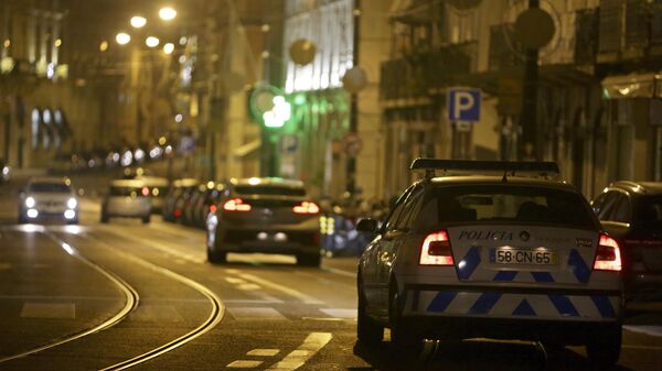 A police car patrols in Lisbon, Monday night, Nov. 9, 2020. - Sputnik International