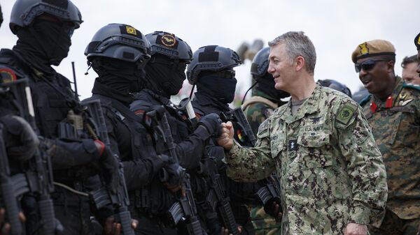 Rear Admiral Milton Sands, Commander of the U.S. Special Operations Command Africa (SOCAF) greets Ghanaian soldiers during Flintlock 2023 at Sogakope beach resort, Ghana, Tuesday, March 14, 2023.  - Sputnik International