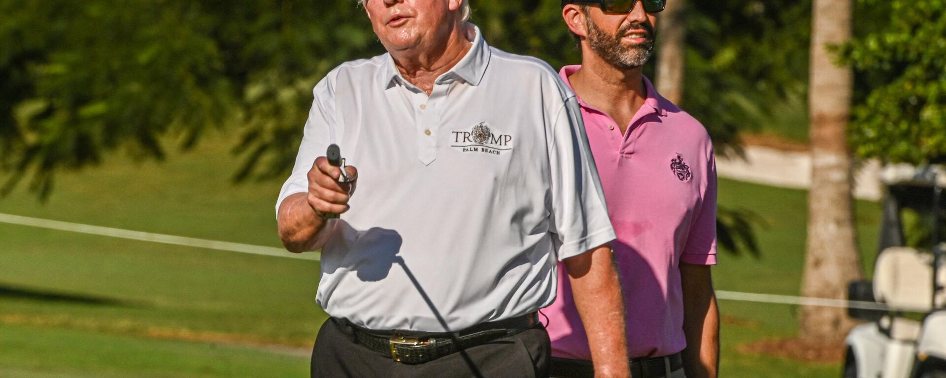 Former US President Donald Trump and his son, Donald Trump, Jr., play golf at Trump National Doral Miami golf club on October 27, 2022 in Miami, Florida - Sputnik International, 1920, 31.03.2023