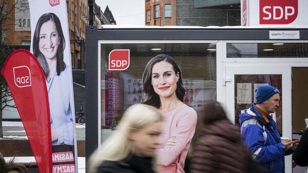 An election poster of Social Democratic Party SDP chair and Finnish Prime Minister Sanna Marin is displayed on an campaign booth in Helsinki, on March 31, 2023 - Sputnik International
