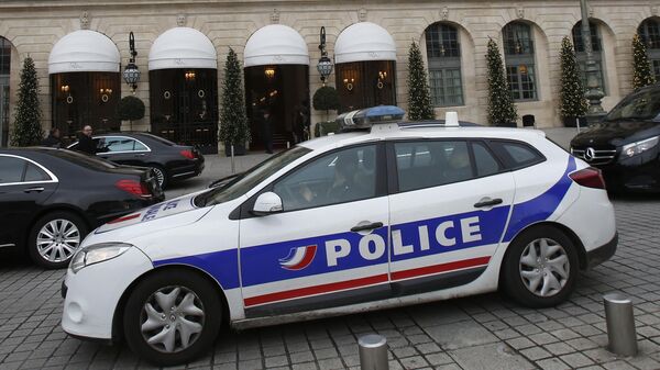 In this April 15, 2020 file photo a police car drives past the Ritz hotel in Paris. - Sputnik International