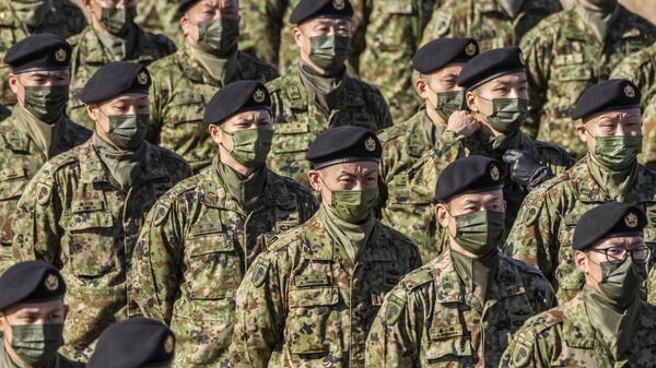 Japan's Ground Self-Defence Force 1st Airborne Brigade personnel stand in formation during the defence minister's speech following in a joint military exercise among Japan, the US, Britain and Australia at Narashino exercise field in Funabashi of Chiba prefecture - Sputnik International