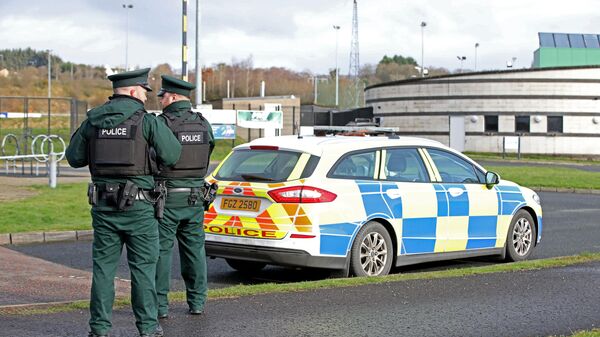 Police officers work at the scene of a shooting of an off duty policeman  at the Killyclogher Road sports complex in the northern Irish town of Omagh on February 23, 2023 - Sputnik International