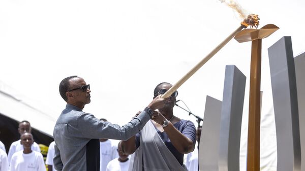 Rwanda's President Paul Kagame, left, and his wife Jeannette, light a commemorative flame during a ceremony at the Kigali Genocide Memorial in Kigali, Rwanda, Friday, April 7, 2023.  - Sputnik International