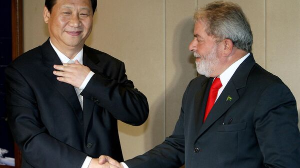 China's then-Vice-President Xi Jinping  (L) shakes hands with Brazilian President Luiz Inacio Lula da Silva, during a meeting in Brasilia, Brazil on February 19, 2009. - Sputnik International