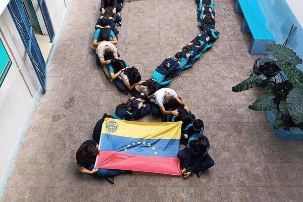 Children at the Venezuelan Turca Maarif international schools in Caracas show their solidarity with the victims of the 2023 earthquake in Turkiye and Syria. - Sputnik International