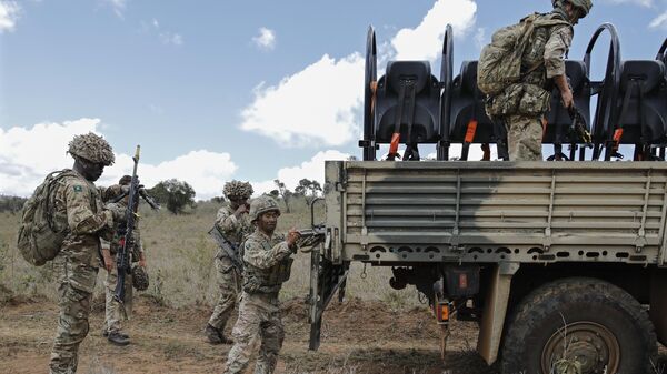 Soldiers that are part of a training battle group comprising 1 Rifles, 1 Yorks and 1 Irish Guards battalions mount their transport vehicles during a British Army Training Unit in Kenya (BATUK) training excercise at the Loldaiga conservancy in Laikipia, on the foot of Mount Kenya, on November 14, 2022.  - Sputnik International