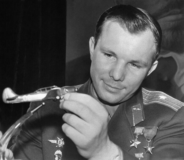 Pilot-Cosmonaut of the USSR, Hero of the Soviet Union Yuri Gagarin with a model of a sports plane. Yuri Gagarin learned to fly in such a plane while he was a cadet at the Saratov Aero Club in 1955. The model was presented to him by pilots of the Central Aero Club of the USSR named after V. Chkalov. - Sputnik International