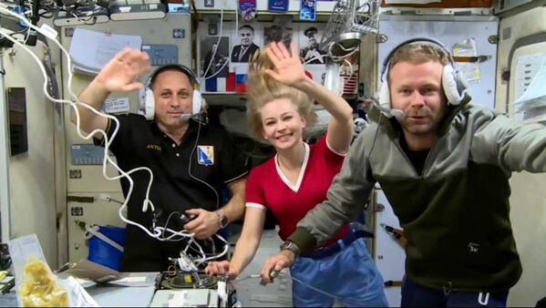 Astronaut Anton Shkaplerov, actress Yulia Peresild, and director Klim Shippenko (left to right) on the International Space Station.Russian actress Yulia Peresild and movie director Klim Shipenko spent 12 days on the ISS starting October 5, 2021 to shoot the first-ever movie made in space, called &quot;The Challenge.&quot; - Sputnik International