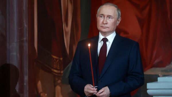 Russian President Vladimir Putin attending the midnight Easter service at the Cathedral of Christ the Savior in Moscow. April 24, 2022. - Sputnik International