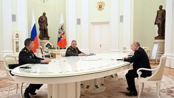 Russian President Vladimir Putin holds a meeting with Chinese Defense Minister Li Shangfu. Russian Defense Minister Sergey Shoigu attended the meeting too. - Sputnik International