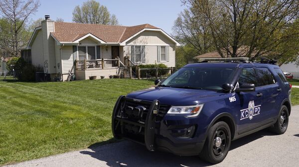 A police officer drives past the house Monday, April 17, 2023, where 16-year-old Ralph Yarl was shot  - Sputnik International