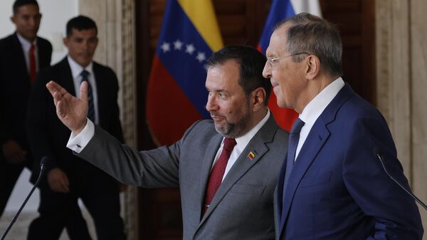 Venezuela's Foreign Minister Yvan Gil, left center, and Russia's Foreign Minister Sergei Lavrov, talk after a press conference at the Foreign Ministry in Caracas, Venezuela, Tuesday, April 18, 2023.  - Sputnik International