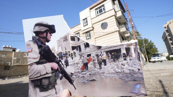 A photograph of a US soldier securing the area near a destroyed building after two car bombs detonated in a central Baghdad residential neighborhood, Friday, Nov. 18, 2005, killing at least six people and wounding dozens, is inserted into the scene at the same location Friday, March 10, 2023, 20 years after the U.S. led invasion on Iraq and subsequent war - Sputnik International