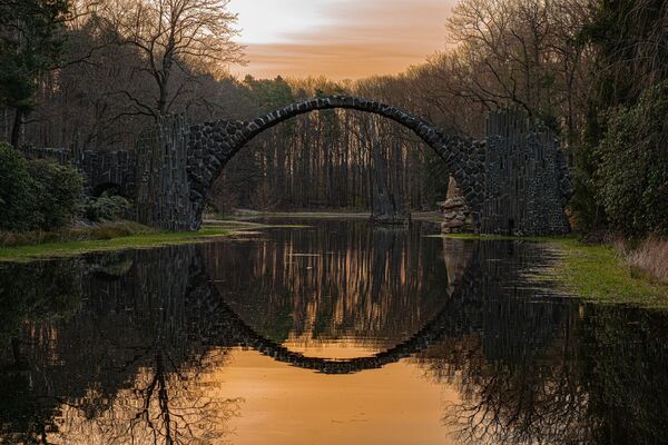 Devil&#x27;s Bridge, Germany. This structure was designed to create a circle, one half of which is formed by the bridge itself and the other is formed by the bridge&#x27;s reflection in the water. - Sputnik International