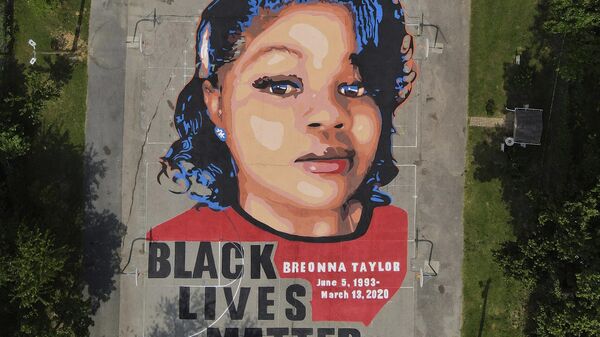FILE - A ground mural depicting a portrait of Breonna Taylor is seen at Chambers Park in Annapolis, Md., July 6, 2020. The former Louisville Metro Police officer who fatally shot Breonna Taylor has a new job in law enforcement. WHAS-TV reported that the Carroll County Sheriff’s Office confirmed Saturday, April 24, 2023, the hiring of Myles Cosgrove who was fired from the police department in January 2021 for violating use-of-force procedures and failing to use a body camera during the raid on Taylor’s apartment.  - Sputnik International