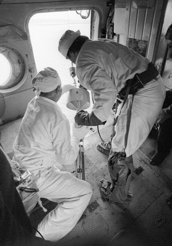 The radioactive material released into the atmosphere contaminated an area of approximately 4,000 square kilometers, primarily in Ukraine and Belarus.Above: Specialists from a helicopter take water samples from the Chernobyl NPP reactor coolers after the disaster. - Sputnik International