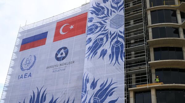 Banner at the Akkuyu nuclear power plant under construction in Gulnar, Turkey - Sputnik International