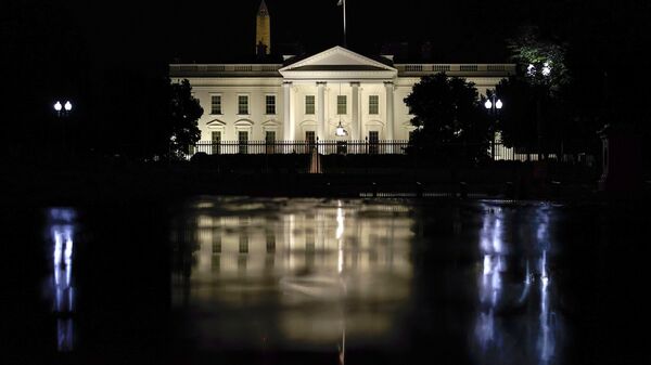 The White House is seen on a rainy night in Washington, Wednesday, June 30, 2021. President Joe Biden will hold a naturalization ceremony Friday at the White House in which 21 immigrants will become citizens. - Sputnik International