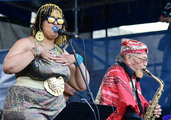 Tara Middleton and Marshall Allen, 94, perform with the Sun Ra Arkestra at the 65th edition of the Jazz Festival in Newport, Rhode Island. The Sun Ra Arkestra was formed in Chicago in the 1950s and mixes big band swing, Afropageantry and jazz.  - Sputnik International