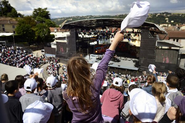 A young fan waves her cap during French-Cameroonian singer Sandra NKake&#x27;s performance at the Théâtre Antique de Vienne, Eastern France, on the first day of the 33rd Vienne Jazz Festival.   NKake aspired to be an English teacher, but life held something different for her. At the age 20, she auditioned for a role and became an actress in theatre. She then turned to music, releasing her debut album &quot;Mansaadi&quot; in 2008. - Sputnik International