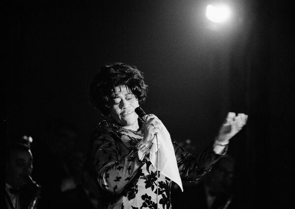 Famed jazz singer Ella Fitzgerald performs at the Empire Room at the Waldorf Astoria Hotel in New York, 1971.  Fitzgerald, known as the &quot;First Lady of Song&quot;, &quot;Queen of Jazz&quot;, and &quot;Lady Ella&quot;, held a 60-year career. She collaborated with Louis Armstrong, Duke Ellington, and left behind numerous immortal hits, such as &quot;&quot;Dream a Little Dream of Me&quot; and &quot;Cheek To Cheek&quot;. - Sputnik International