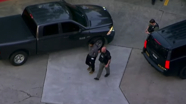 Aerial footage captures moment law enforcement personnel take into custody suspected gunman Deion Patterson, who is alleged to have killed one person and injured four other individuals in Atlanta, Georgia, on May 3, 2023. - Sputnik International