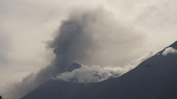 The Volcan de Fuego, or Volcano of Fire, blows outs a thick cloud of ash, seen from San Miguel Duenas, Guatemala, Thursday, Sept. 23, 2021. According to a bulletin published by the Guatemalan Vulcanology Institute, the volcano has spewed lava and ash in a series of explosions that have not yet forced any evacuations. - Sputnik International