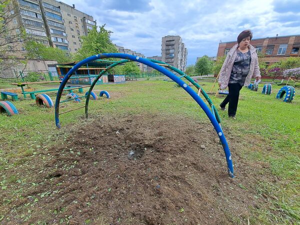 A crater after shelling by the Ukrainian Armed Forces at a playground in a residential area of Gorlovka - Sputnik International