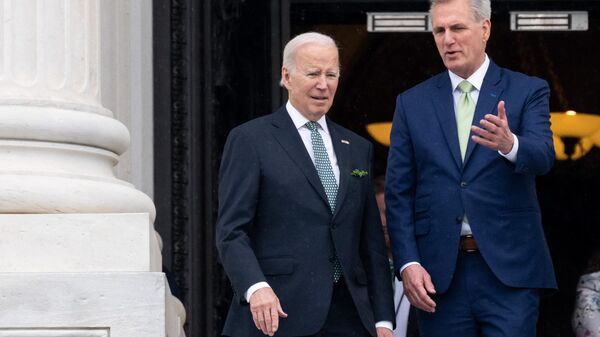 US President Joe Biden, accompanied by Speaker of the House Kevin McCarthy, Republican of California, departs after the annual Friends of Ireland luncheon on St. Patrick's Day at the US Capitol in Washington, DC, on March 17, 2023 - Sputnik International