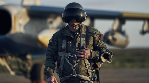 In this photo taken on Thursday, May 4, 2023, a Ukrainian air force pilot goes near his Su-25 ground attack jet on his base in Eastern Ukraine - Sputnik International