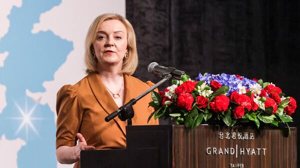 Britain's former prime minister Liz Truss delivers a speech as part of her five-day visit to Taiwan, in Taipei on May 17, 2023 - Sputnik International