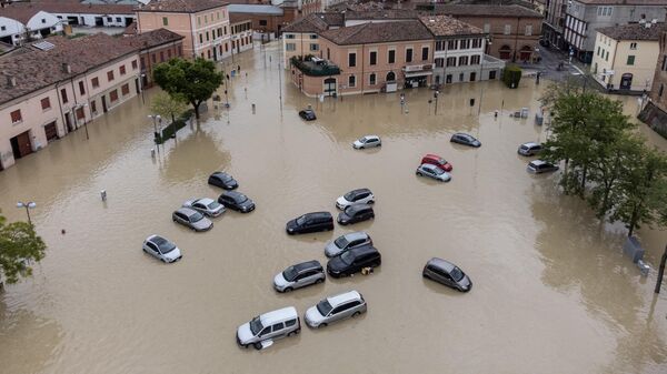 This aerial photograph shows flooded streets in the town of Lugo, near Ravenna, on May 18, 2023, after heavy rains caused flooding across Italy's northern Emilia Romagna region. Rescue workers searched on May 18, 2023 for people still trapped by floodwaters in northeast Italy as more residents were evacuated after downpours which killed nine people and devastated homes and farms. - Sputnik International