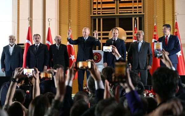 Prior to the elections, Erdogan said that Turkish voters would have to make &quot;the most important choice of their lives, a decision concerning the future&quot; of the country and its children.Above: Turkiye&#x27;s incumbent President Recep Tayyip Erdogan, center, addresses supporters in front of the Presidential Palace in Ankara. - Sputnik International