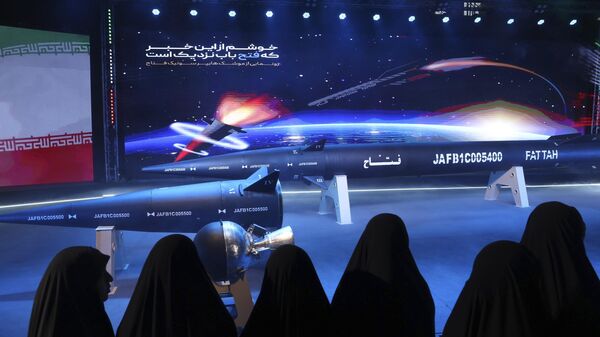 Women look at Fattah missile in a ceremony in Tehran, Iran, Tuesday, June 6, 2023. - Sputnik International