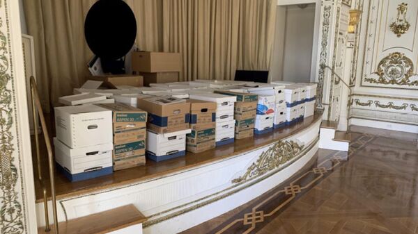 This image, contained in the indictment against former President Donald Trump, shows boxes of records being stored on the stage in the White and Gold Ballroom at Trump's Mar-a-Lago estate in Palm Beach, Fla. Trump is facing 37 felony charges related to the mishandling of classified documents according to an indictment unsealed Friday, June 9, 2023.  - Sputnik International