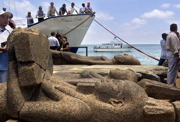 A large statue of the god Hapi, foreground, and other two unidentified statues lay on the deck of a boat in Alexandria, Egypt Thursday, June 7, 2001, after a French underwater archaeological team raised them to the surface along with other precious items that had laid hidden in the murky depths. Researchers said Thursday, they have only just begun to probe the extraordinary treasures of the sunken city of Herakleion. More than 1,000 years ago, an earthquake sent the Pharaonic city of Heracleion to the bottom of the Mediterranean.   - Sputnik International