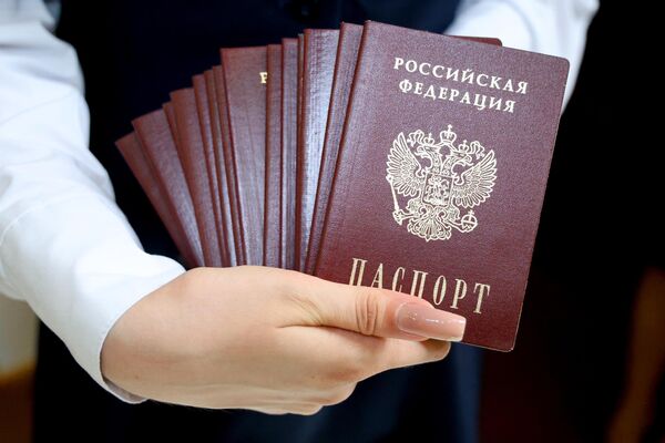 At least 3.5 million people participated in about 4.3 thousand Russia Day events held in 2022.Above: Russian passports to be distributed in Donetsk during the Russia Day Celebrations. - Sputnik International