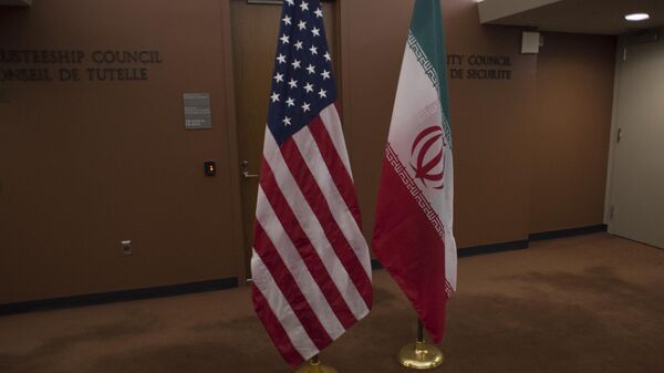The US (L) and Iranian flags. - Sputnik International