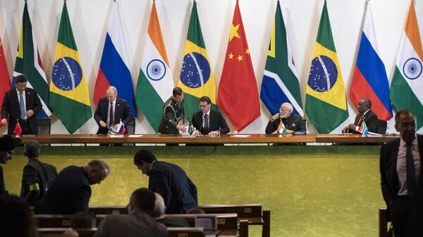 China's President Xi Jinping (L), Russia's President Vladimir Putin (2nd L), Brazil's President Jair Bolsonaro (C), India's Prime Minister Narendra Modi (2nd R), and South Africa's President Cyril Ramaphosa (R) attend to a meeting with members of the Business Council and management of the New Development Bank during the BRICS Summit in Brasilia, November 14, 2019 - Sputnik International