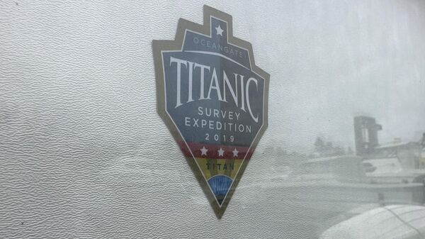 The logo for an OceanGate Expeditions 2019 Titanic expedition is seen on a marine industrial warehouse office door in Everett, Wash., Tuesday, June 20, 2023.  - Sputnik International