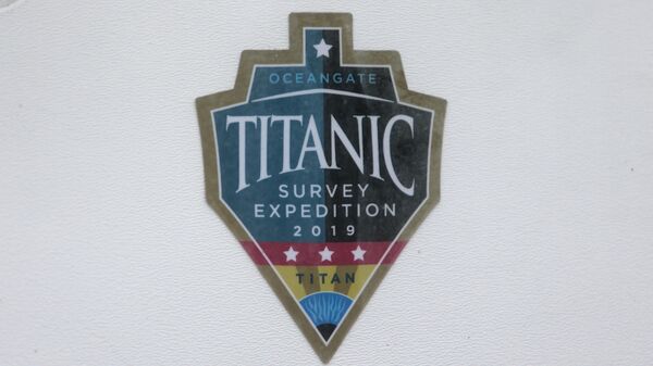 A decal which reads Titanic Survey Expedition 2019 Titan is pictured on a window at OceanGate at the Port of Everett Boat Yard in Everett, Washington, on June 20, 2023. - Sputnik International