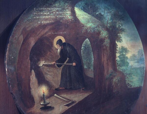 A 19th century icon &quot;St. Anthony Pechersky digging a cave.&quot; Anthony, also referred to as Anthony of Kiev and Anthony of the Caves, is regarded as one of the founders of Kiev-Pechersk Lavra. - Sputnik International