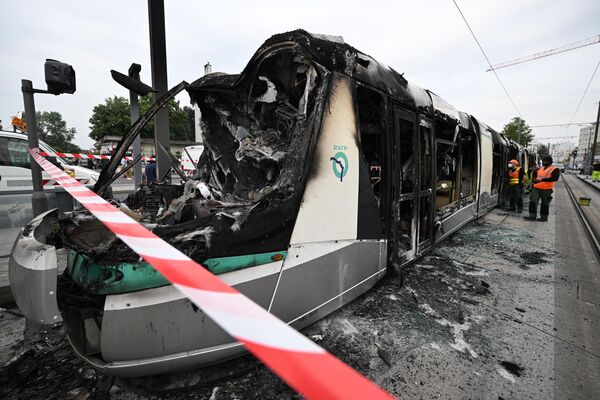 This photograph taken on June 29, 2023 in Clamart, southwest of Paris, shows a burnt tram following violence and protests in the suburb the previous night in reaction to the shooting of a 17-year-old boy. - Sputnik International