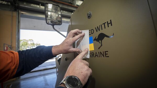 United With Ukraine decal fitted to an Australian armored vehicle being delivered to Kiev. File photo. - Sputnik International